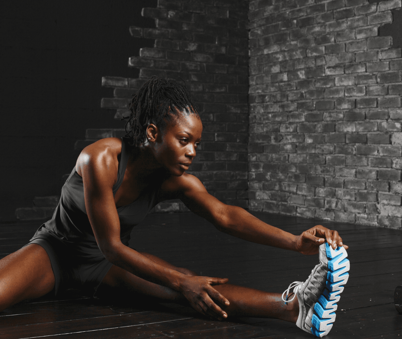 Women athlete stretching